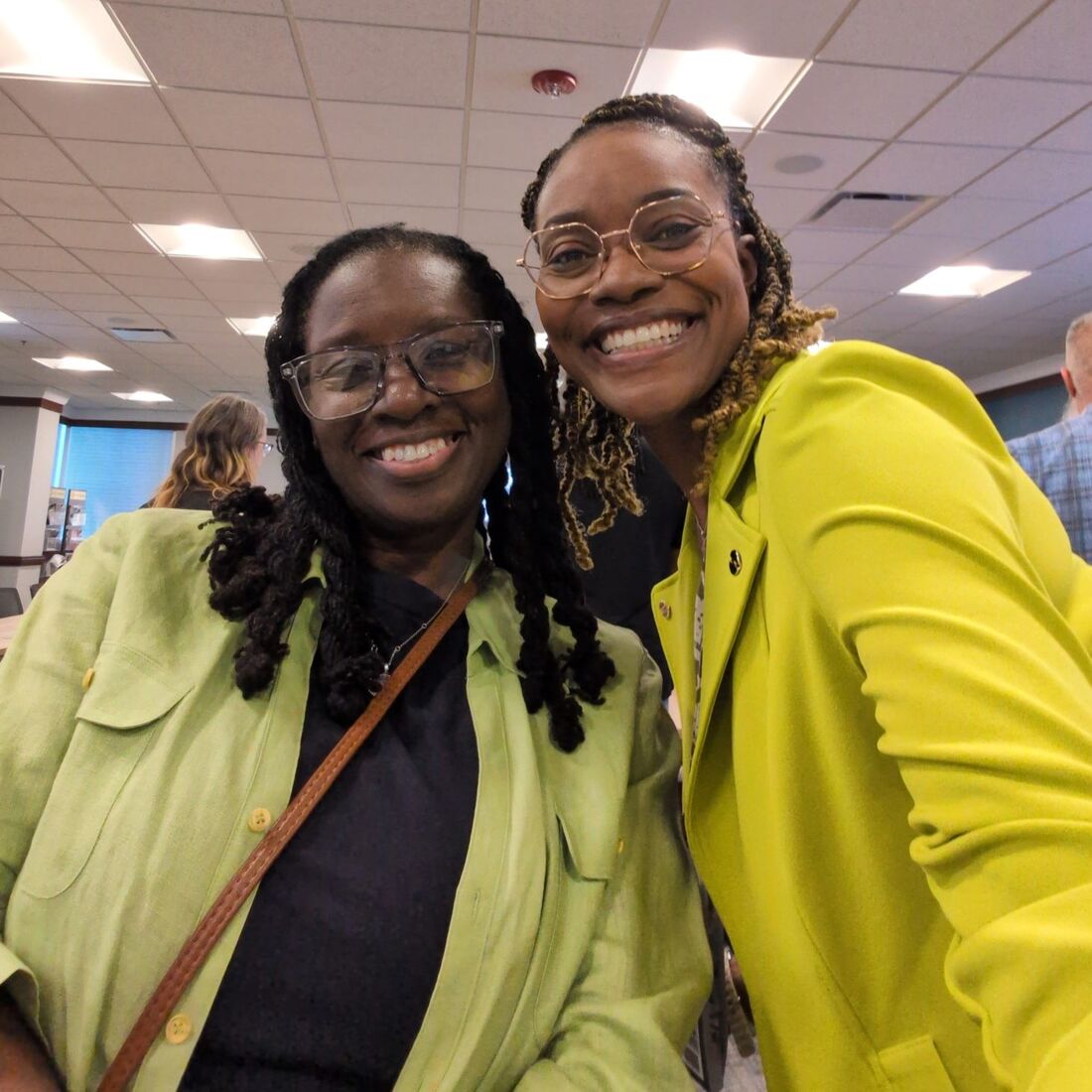 Two women smiling together at a Gwinnett Chamber of Commerce event